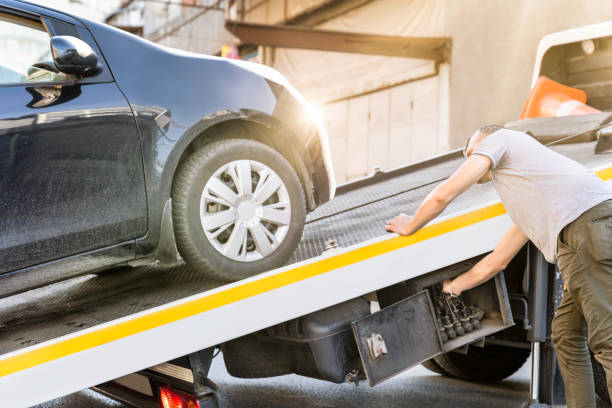 vehicle being loaded onto a tow truck